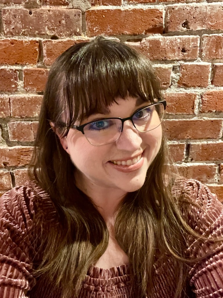 Photo of owner of 3 mile lane co with a brick background